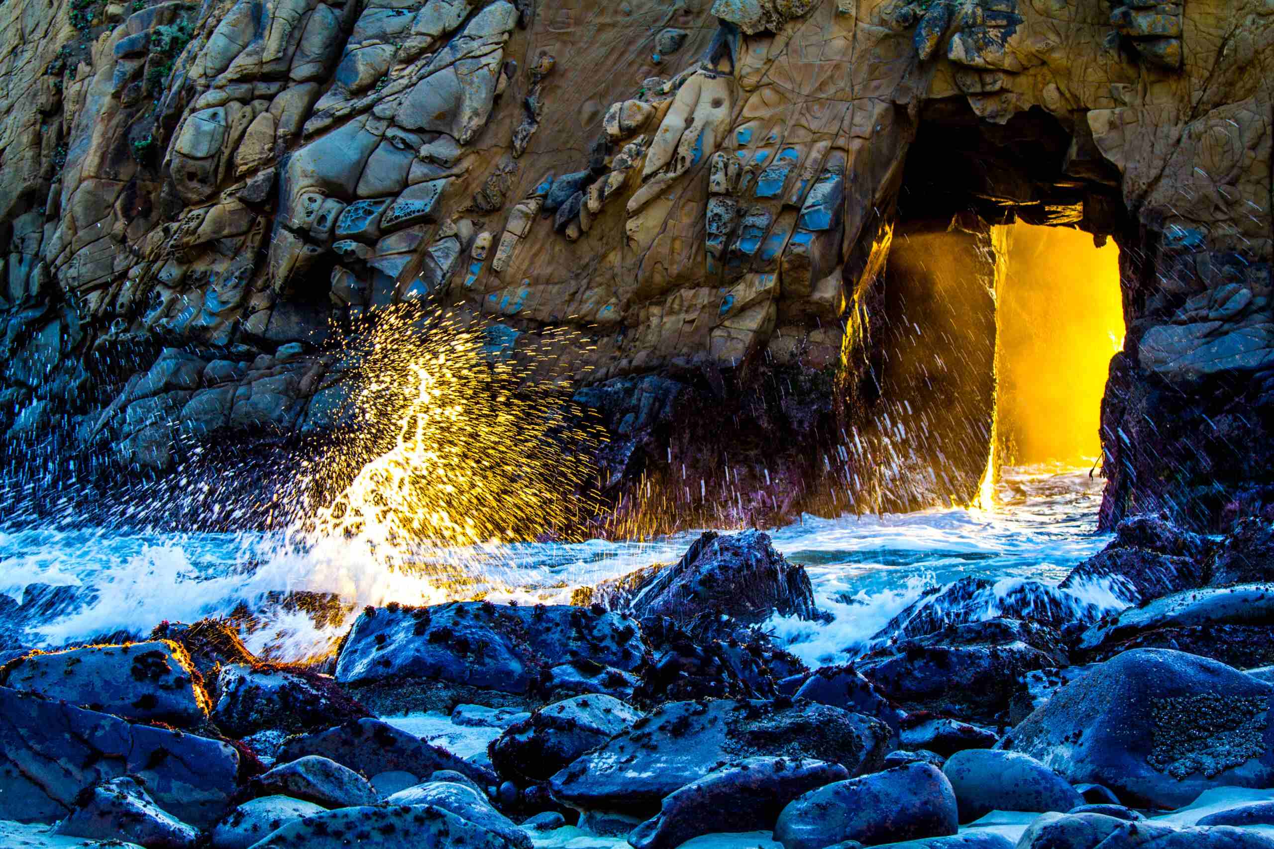 An artwork of a cave beside the shores